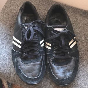 Diesel black leather sneakers w/ white stripes